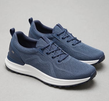 Casual caramel-toned shoes styled with modern streetwear on a clean white surface.