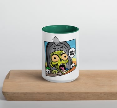 Funny zombie coffee mug featuring a cartoon ghoul rising from a grave with a Rise and Shine speech bubble.