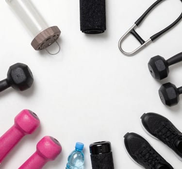 Bright, modern cardio machines lined up in a spacious gym with natural light.