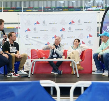 a group of people sitting on a stage