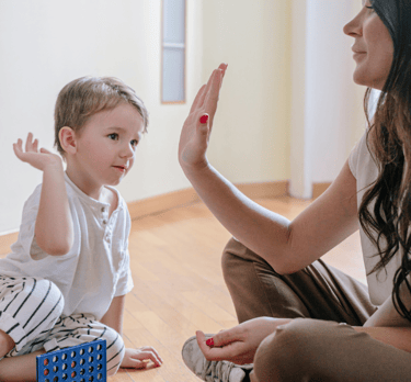 a mother doing hi fi with baby