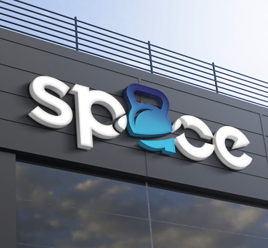 facade of a business building with the application of the space crosstraining logo on a luminous sig