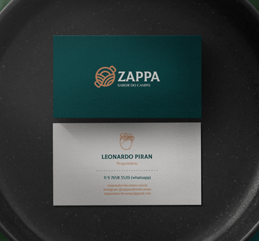 business card with zappa visual identity under a black plate and green leaves