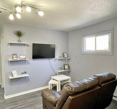 a living room with a couch and a tv
