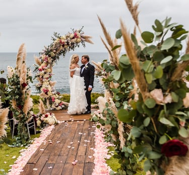 wedding at cuvier park with bride and groom on deck surrounded by flowers