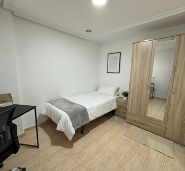 Habitación individual moderna con escritorio