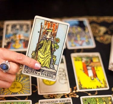 a person holding a tarot card game