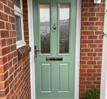 a new chartwell green l front door on red brick house installed by buildmydoor