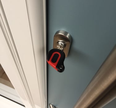an ultion key on a new duck egg blue composite door