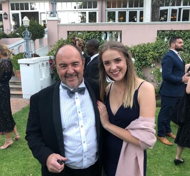 Father-daughter artists Martin and Samantha Osner at a formal gathering.
