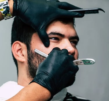 a man with a beard and gloves on his head
