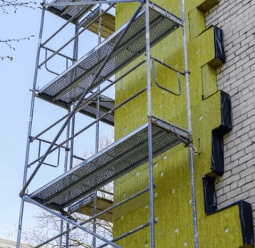 a tall building with a ladder and a ladder
