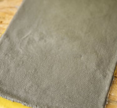 a piece of cloth with a book on it