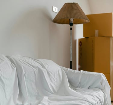 Professional move in and move out cleaning service with boxes in an empty home