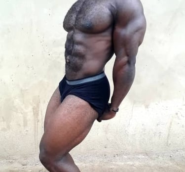 Abuja bodybuilder side triceps pose