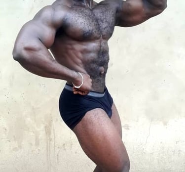 Abuja bodybuilder single bicep pose