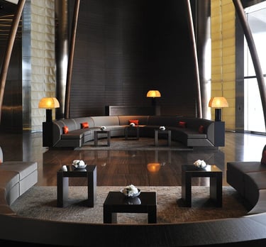 Minimalist lounge interior at Armani Hotel Dubai with curved seating and Armani Casa design elements.
