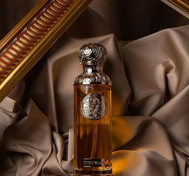 Gissah perfume bottle of perfume sitting on a cloth covered table