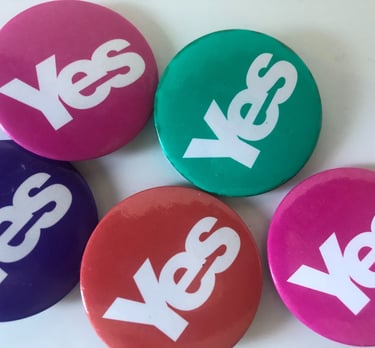 Different coloured Yes badges from the 2014 campaign