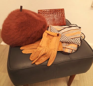a pair of gloves and gloves on a chair