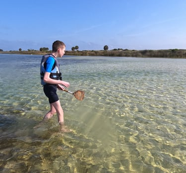 a man in a life jacket is holding a paddle paddle and paddle paddle