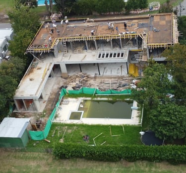 a house being built into a house with a pool and a pool