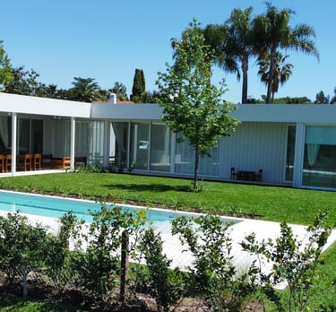 a pool in a backyard with a pool and a fence