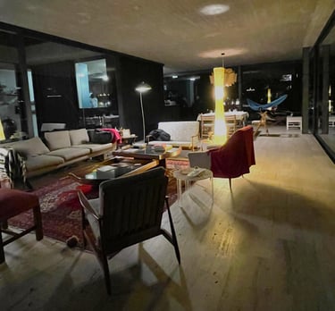 a living room with a couch and chairs