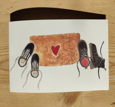 a queer romantic greetings card of a doormat with vans and doc martens