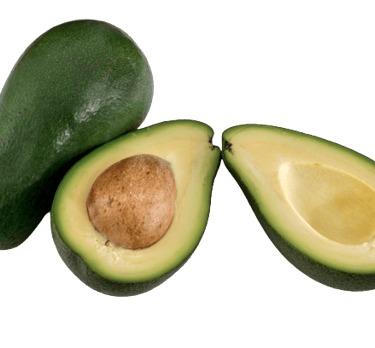 a Nilgiris avocado cut in half and fresh half an avocado