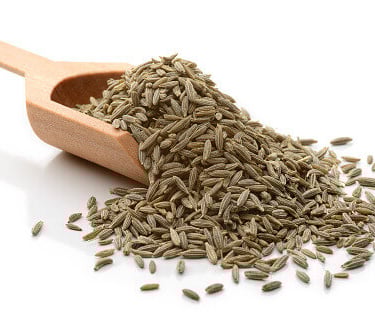 a scoop scooper full of  cumin seeds with transperent background 