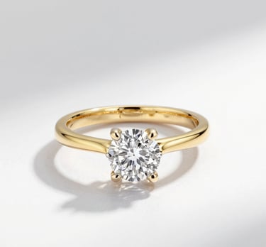 Stacked bangles with intricate patterns catching the sunlight on a wooden surface.