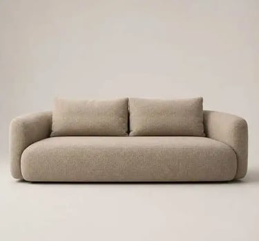 Contemporary low-profile beige bouclé sofa with clean lines and a sculptural silhouette, adding warm