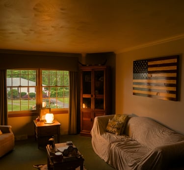 a living room with a couch and a lamp