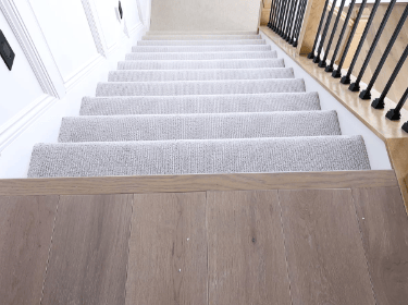 grey carpet stains with wooden floor landing