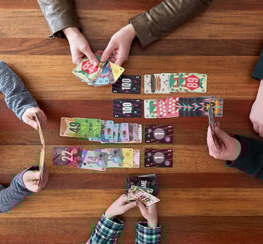 a group of people playing cards and playing cards