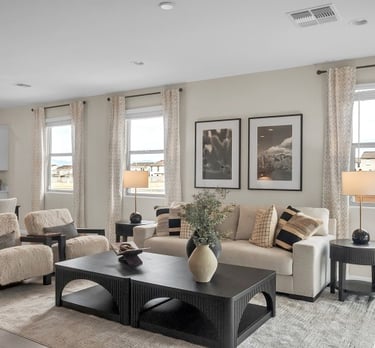 a living room with a couch and chairs