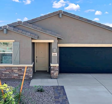a house with a garage door and a garage door