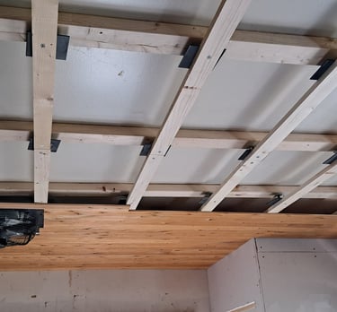 Wood ceiling framing installation in progress for residential levelling renovation project in Canada