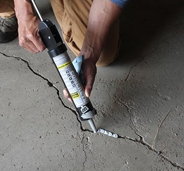 a crack specialist is repairing a crack