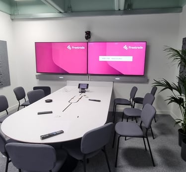 MountMyTV - dual 50" monitors, dual LG soundbas & conference camera mounted on a wall in a boardroom