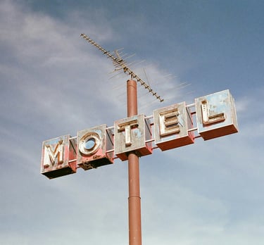 Neon motel sign next the road. Best practices for operational efficiency in hotels with Timea Pokol