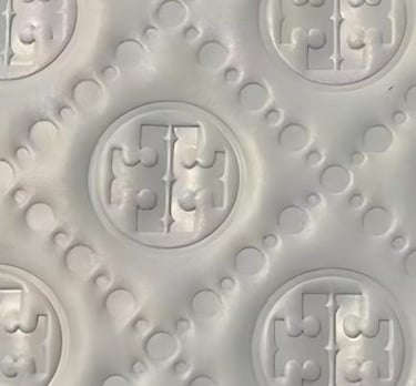 Detailed debossed pattern on material, creating a subtle and tactile finish by King Fly.