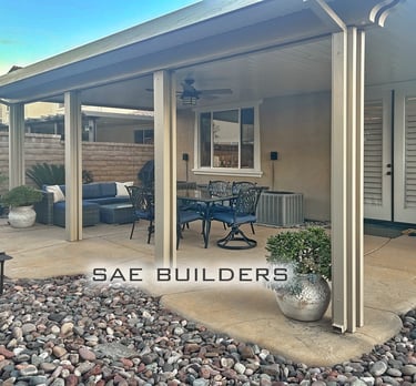 Solid Alumawood patio cover attached to home with ceiling fan. Located in French Valley, California