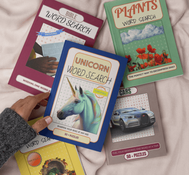 Debas Direct word search puzzle books displayed on beige blanket