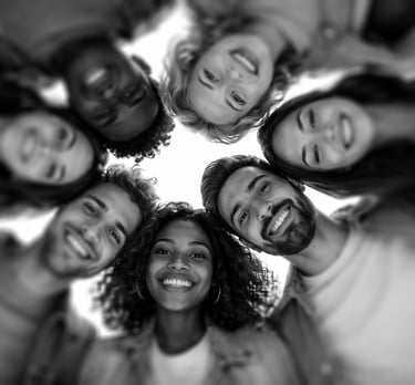 camera looking up to a circle of diverse people in a circle looking down with happy faces