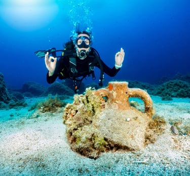 Taucherin über Artefakt