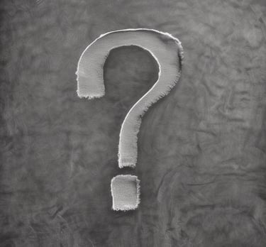 Close-up of hands sketching natural patterns and mathematical shapes on paper.