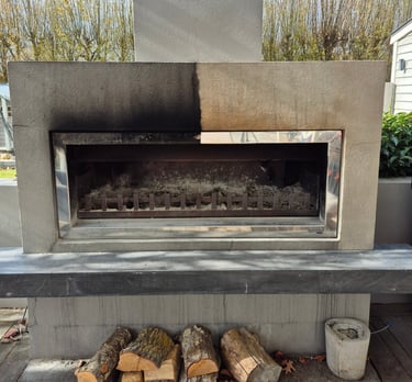 Before and after professional cleaning of a modern concrete outdoor fireplace with firewood.