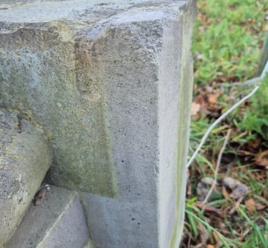 Basalt heritage stone buiding detail partially cleaned with laser cleaner
